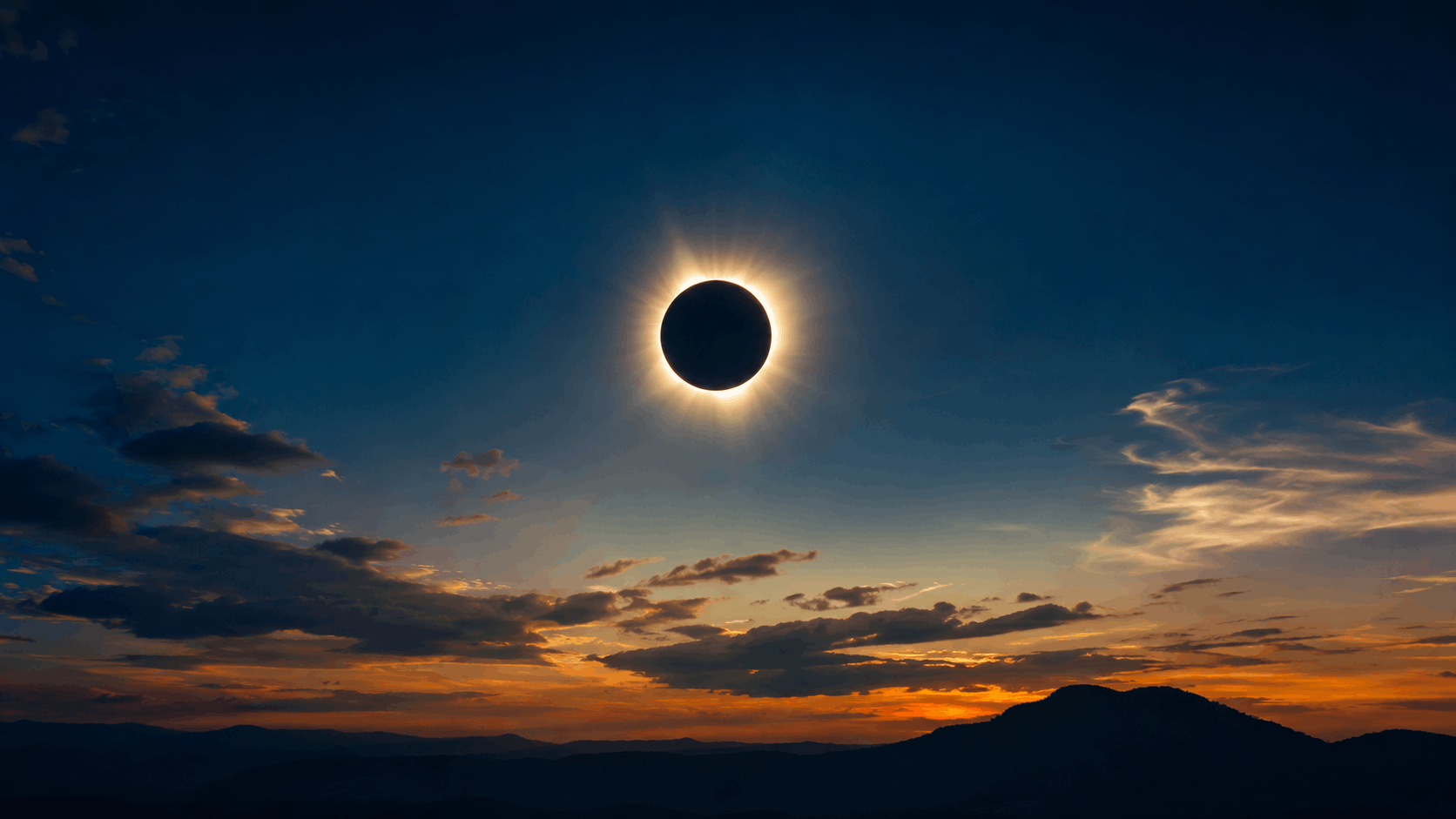 Eclipse solar de 2026 con la corona visible sobre un horizonte de montañas al atardecer